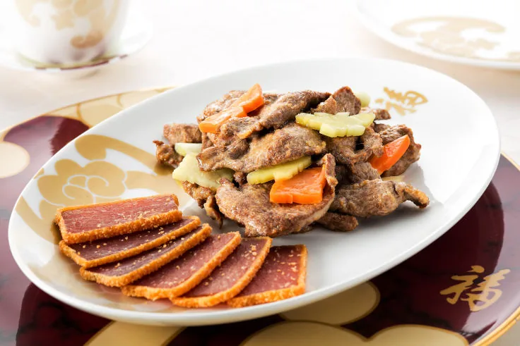 Sautéed pigeon fillet plated with caramelised Jinhua ham.